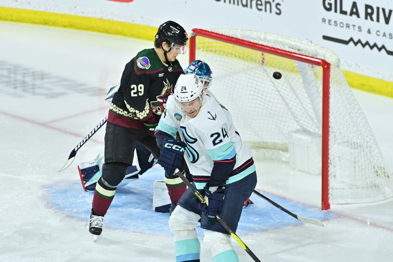 Nov 7, 2023; Tempe, Arizona, USA; Arizona Coyotes right wing Clayton Keller (not pictured) scores on Seattle Kraken goaltender Joey Daccord (35) as center Barrett Hayton (29) and defenseman Jamie Oleksiak (24) look on in the third period at Mullett Arena. Mandatory Credit: Matt Kartozian-USA TODAY Sports