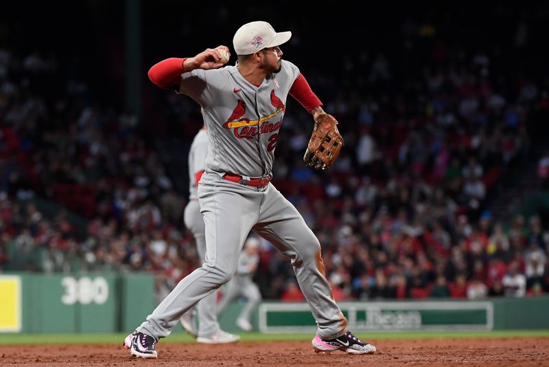 May 14, 2023; Boston, Massachusetts, USA; St. Louis Cardinals third baseman Nolan Arenado (28) throws Boston Red Sox left fielder Masataka Yoshida (7) out at first base during the third inning at Fenway Park. Mandatory Credit: Eric Canha-USA TODAY Sports