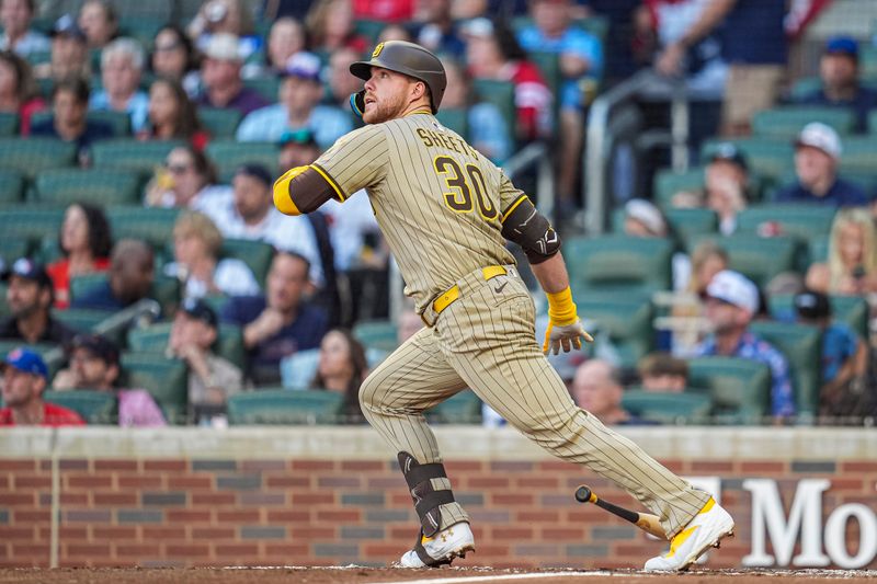 May 23, 2025; Cumberland, Georgia, USA; San Diego Padres designated hitter Gavin Sheets (30) hits a home run against the Atlanta Braves during the second inning at Truist Park. Mandatory Credit: Dale Zanine-Imagn Images