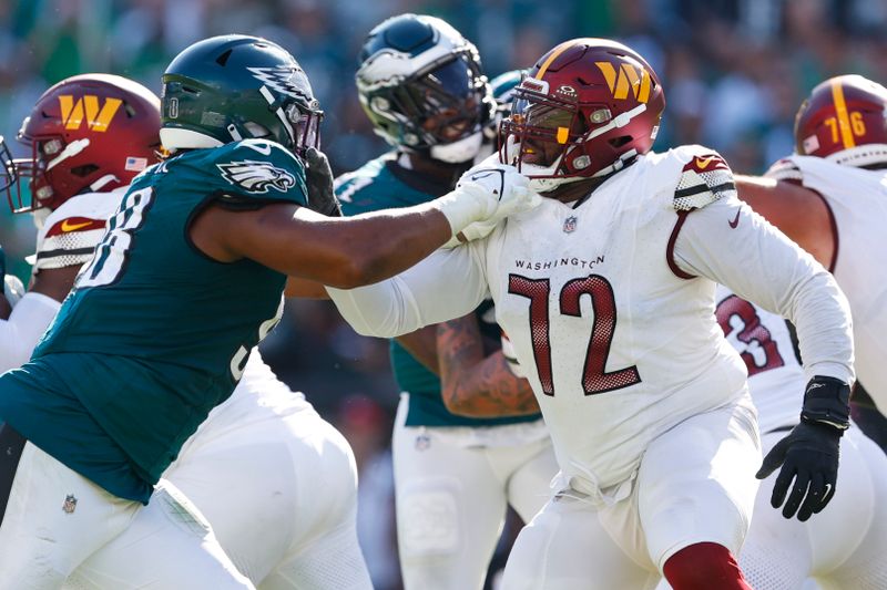 Philadelphia Eagles defensive tackle Jalen Carter (98) in action against Washington Commanders offensive tackle Charles Leno Jr. (72) during an NFL football game, Sunday, Oct. 1, 2023, in Philadelphia. The Eagles defeated the Commanders 34-31. (AP Photo/Rich Schultz)