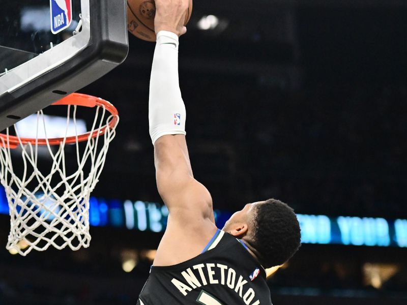 ORLANDO, FLORIDA - JANUARY 10: Giannis Antetokounmpo #34 of the Milwaukee Bucks looks to dunk the ball over Goga Bitadze #35 of the Orlando Magic in the first half of a game at Kia Center on January 10, 2025 in Orlando, Florida. NOTE TO USER: User expressly acknowledges and agrees that, by downloading and or using this photograph, User is consenting to the terms and conditions of the Getty Images License Agreement. (Photo by Julio Aguilar/Getty Images)