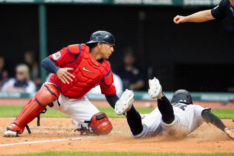 Apr 14, 2024; Cleveland, Ohio, USA; Cleveland Guardians catcher Bo Naylor (23) tags out New York Yankees infielder Kevin Smith (74) for the second out of the tenth inning at Progressive Field. Mandatory Credit: Scott Galvin-USA TODAY Sports