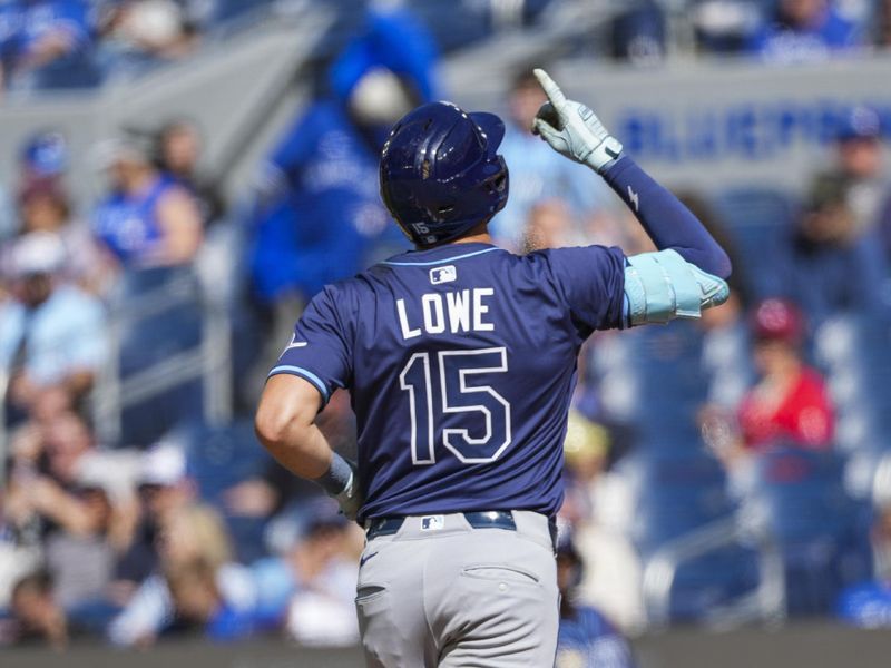 May 15, 2025; Toronto, Ontario, CAN; Tampa Bay Rays second base Josh Lowe (15) crosses home plate after hitting a home run against the Toronto Blue Jays during the fifth inning at Rogers Centre. Mandatory Credit: Kevin Sousa-Imagn Images