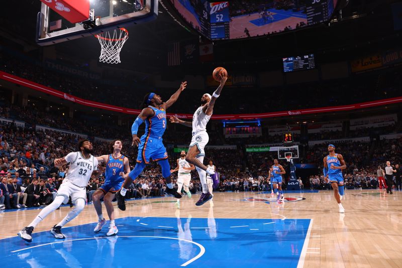 OKLAHOMA CITY, OK - JANUARY 29: Nickeil Alexander-Walker #9 of the Minnesota Timberwolves drives to the basket during the game against the Oklahoma City Thunder on January 29, 2024 at Paycom Arena in Oklahoma City, Oklahoma. NOTE TO USER: User expressly acknowledges and agrees that, by downloading and or using this photograph, User is consenting to the terms and conditions of the Getty Images License Agreement. Mandatory Copyright Notice: Copyright 2024 NBAE (Photo by Zach Beeker/NBAE via Getty Images)