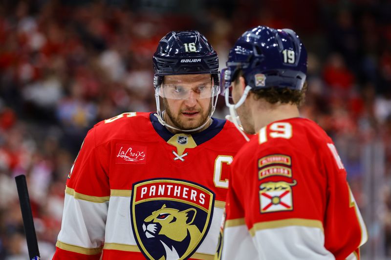 Nov 14, 2024; Sunrise, Florida, USA; Florida Panthers center Aleksander Barkov (16) talks to left wing Matthew Tkachuk (19) during the second period against the New Jersey Devils at Amerant Bank Arena. Mandatory Credit: Sam Navarro-Imagn Images