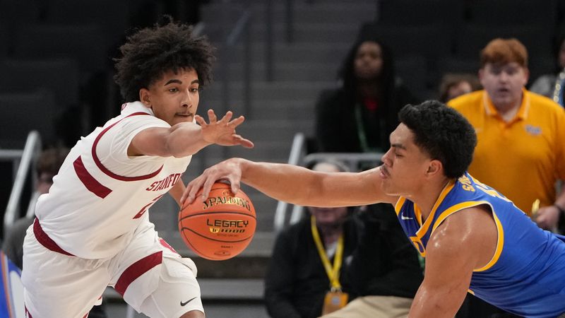 Mar 10, 2026; Charlotte, NC, USA; Stanford Cardinal forward Donavin Young (2) and Pittsburgh Panthers forward Roman Siulepa (13) fight for the ball in the first half at Spectrum Center. Mandatory Credit: Bob Donnan-Imagn Images