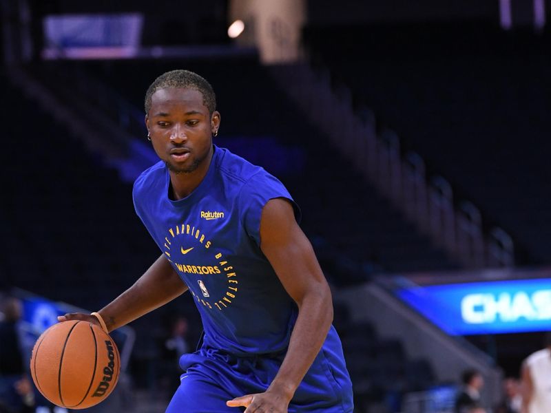 SAN FRANCISCO, CA - OCTOBER 13: Jonathan Kuminga #00 of the Golden State Warriors handles the ball during the game against the Detroit Pistons during a NBA Preseason game on October 13, 2024 at Chase Center in San Francisco, California. NOTE TO USER: User expressly acknowledges and agrees that, by downloading and or using this photograph, user is consenting to the terms and conditions of Getty Images License Agreement. Mandatory Copyright Notice: Copyright 2024 NBAE (Photo by Noah Graham/NBAE via Getty Images)