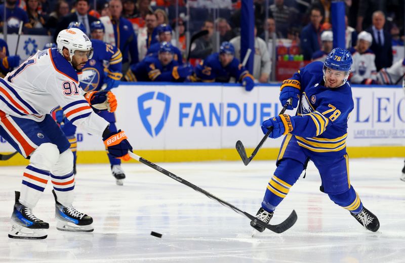 Mar 9, 2024; Buffalo, New York, USA;  Edmonton Oilers left wing Evander Kane (91) tries to block a shot by Buffalo Sabres defenseman Jacob Bryson (78) during the second period at KeyBank Center. Mandatory Credit: Timothy T. Ludwig-USA TODAY Sports