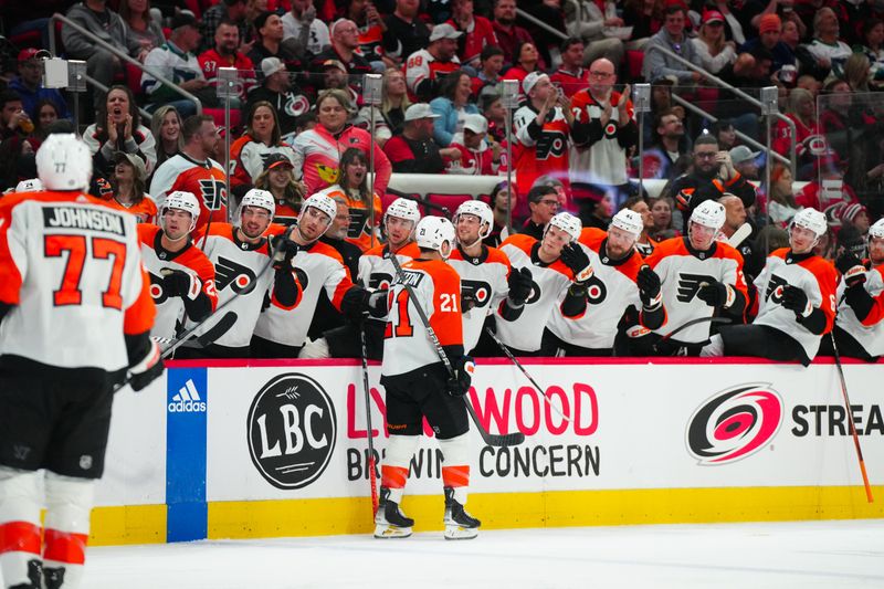 Mar 21, 2024; Raleigh, North Carolina, USA; Philadelphia Flyers center Scott Laughton (21) celebrates his goal against the Carolina Hurricanes during the second period at PNC Arena. Mandatory Credit: James Guillory-USA TODAY Sports