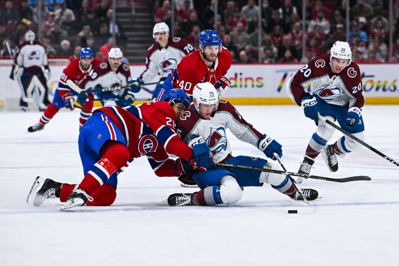 Jan 15, 2024; Montreal, Quebec, CAN; Montreal Canadiens defenseman Johnathan Kovacevic (26) falls as he defends against Colorado Avalanche right wing Logan O'Connor (25) during the second period at Bell Centre. Mandatory Credit: David Kirouac-USA TODAY Sports