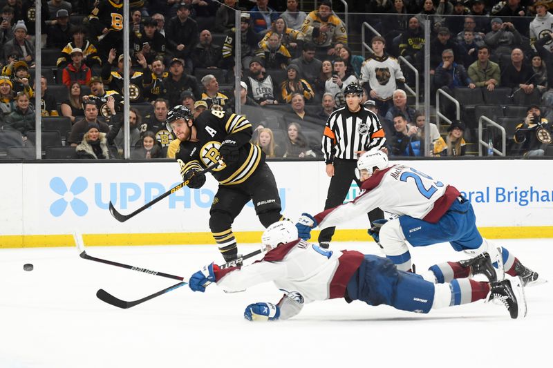 Jan 18, 2024; Boston, Massachusetts, USA; Boston Bruins right wing David Pastrnak (88) scores his third goal of the game in an empty net while Colorado Avalanche defenseman Cale Makar (8) and center Nathan MacKinnon (29) defend during the third period at TD Garden. Mandatory Credit: Bob DeChiara-USA TODAY Sports