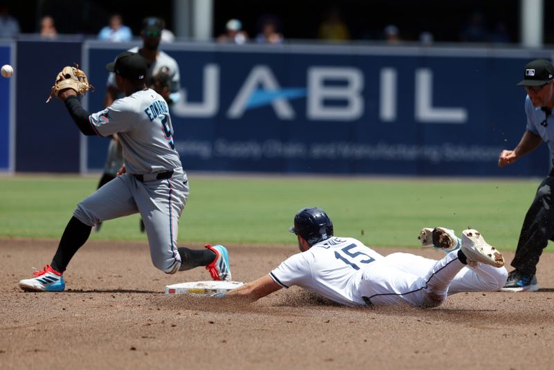 Jun 8, 2025; St. Petersburg, Florida, USA;  Tampa Bay Rays outfielder Josh Lowe (15) slides into second base as he doubles and Miami Marlins infielder Xavier Edwards (9) attempted to tag him out at George M. Steinbrenner Field. Mandatory Credit: Kim Klement Neitzel-Imagn Images