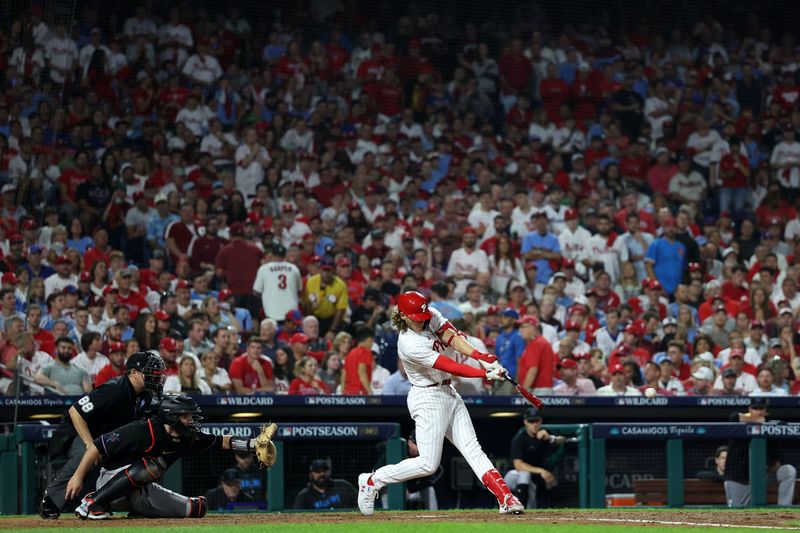 Oct 4, 2023; Philadelphia, Pennsylvania, USA; Philadelphia Phillies first baseman Alec Bohm (28) hits a double against the Miami Marlins during the sixth inning for game two of the Wildcard series for the 2023 MLB playoffs at Citizens Bank Park. Mandatory Credit: Bill Streicher-USA TODAY Sports