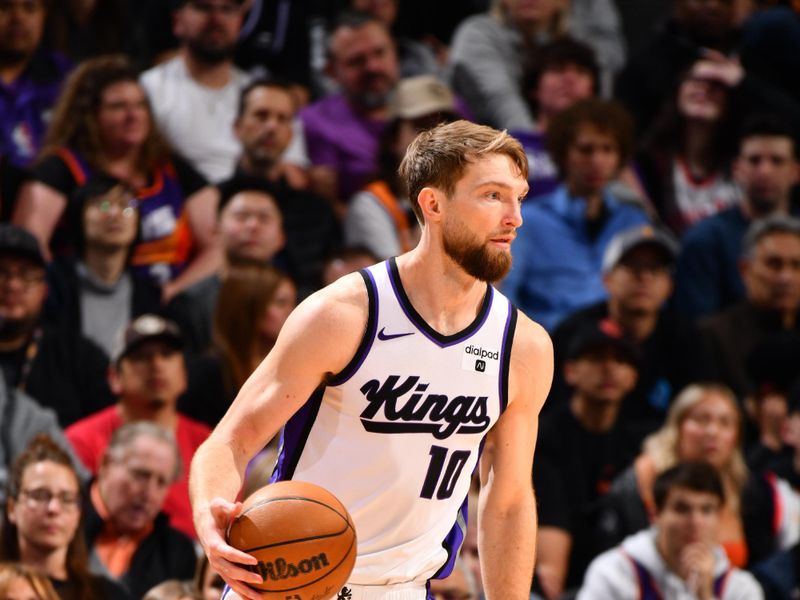 PHOENIX, AZ - FEBRUARY 13: Domantas Sabonis #10 of the Sacramento Kings handles the ball during the game against the Phoenix Suns on February 13, 2024 at Footprint Center in Phoenix, Arizona. NOTE TO USER: User expressly acknowledges and agrees that, by downloading and or using this photograph, user is consenting to the terms and conditions of the Getty Images License Agreement. Mandatory Copyright Notice: Copyright 2024 NBAE (Photo by Barry Gossage/NBAE via Getty Images)