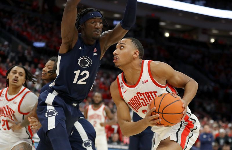 Jan 20, 2024; Columbus, Ohio, USA;  Ohio State Buckeyes forward Zed Key (23) drives to the basket as Penn State Nittany Lions forward Favour Aire (12) defends during the second half at Value City Arena. Mandatory Credit: Joseph Maiorana-USA TODAY Sports