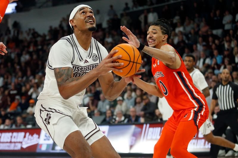 Jan 27, 2024; Starkville, Mississippi, USA; Mississippi State Bulldogs forward Tolu Smith (1) shoots as Auburn Tigers guard/forward Chad Baker-Mazara (10) defends during the second half at Humphrey Coliseum. Mandatory Credit: Petre Thomas-USA TODAY Sports