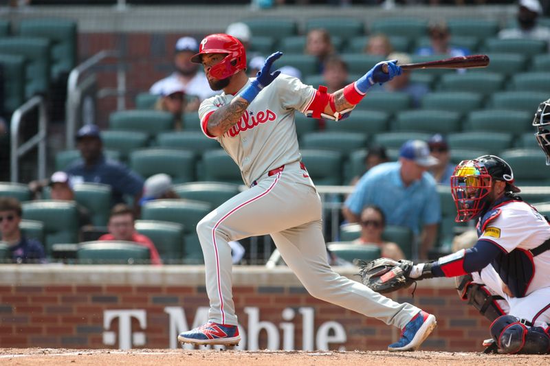 Jul 7, 2024; Atlanta, Georgia, USA; Philadelphia Phillies shortstop Edmundo Sosa (33) hits a single against the Atlanta Braves in the ninth inning at Truist Park. Mandatory Credit: Brett Davis-USA TODAY Sports