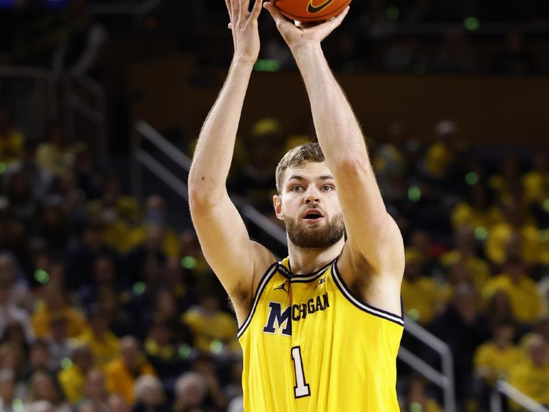 Feb 18, 2023; Ann Arbor, Michigan, USA;  Michigan Wolverines center Hunter Dickinson (1) shoots the ball against the Michigan State Spartans in the first half at Crisler Center. Mandatory Credit: Rick Osentoski-USA TODAY Sports