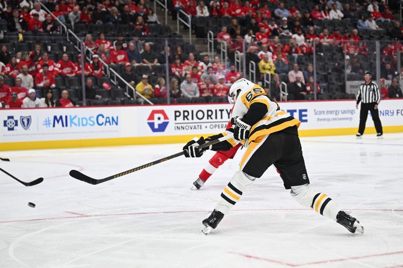 Oct 10, 2024; Detroit, Michigan, USA; Pittsburgh Penguins defenseman Erik Karlsson (65) scores a goal during the third period against the Detroit Red Wings at Little Caesars Arena. Mandatory Credit: Tim Fuller-Imagn Images