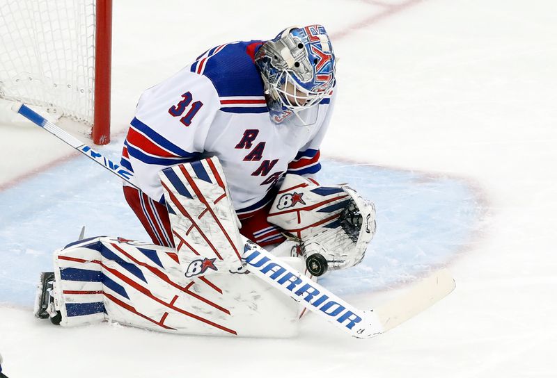 Dec 20, 2022; Pittsburgh, Pennsylvania, USA;  New York Rangers goaltender Igor Shesterkin (31) makes a save against the Pittsburgh Penguins during the second period at PPG Paints Arena. Mandatory Credit: Charles LeClaire-USA TODAY Sports