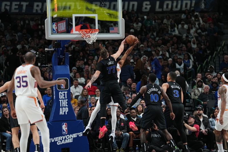 DALLAS, TX - JANUARY 24: Luka Doncic #77 of the Dallas Mavericks blocks the shot by Keita Bates-Diop #21 of the Phoenix Suns during the game on January 24, 2024 at the American Airlines Center in Dallas, Texas. NOTE TO USER: User expressly acknowledges and agrees that, by downloading and or using this photograph, User is consenting to the terms and conditions of the Getty Images License Agreement. Mandatory Copyright Notice: Copyright 2024 NBAE (Photo by Glenn James/NBAE via Getty Images)