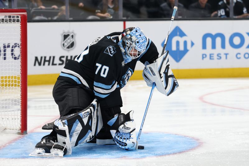 Feb 27, 2026; Salt Lake City, Utah, USA; Utah Mammoth goaltender Karel Vejmelka (70) blocks a shot by the Minnesota Wild during the first period at Delta Center. Mandatory Credit: Rob Gray-Imagn Images