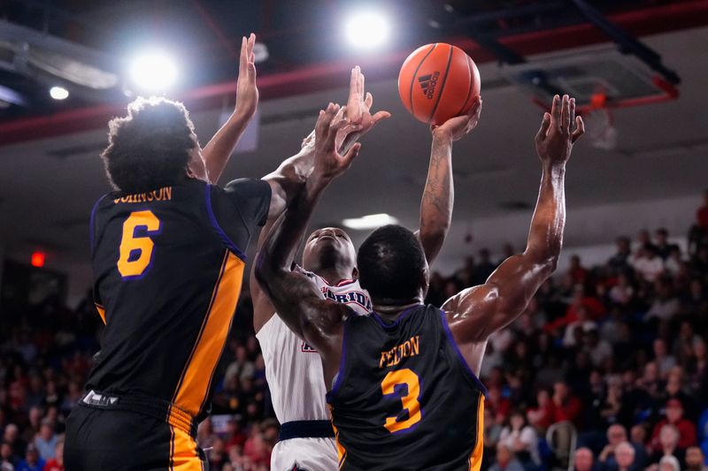 Jan 2, 2024; Boca Raton, Florida, USA; Florida Atlantic Owls guard Johnell Davis (1) shoots the ball against the East Carolina Pirates during the second half at Eleanor R. Baldwin Arena. Mandatory Credit: Rich Storry-USA TODAY Sports