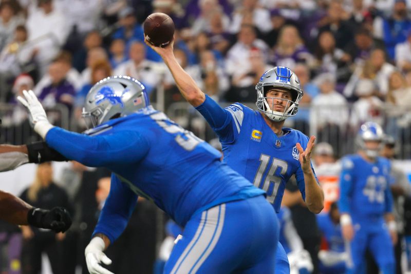 Detroit Lions quarterback Jared Goff (16) throws a pass during the first half of an NFL football game against the Minnesota Vikings, Sunday, Dec. 24, 2023, in Minneapolis. (AP Photo/Bruce Kluckhohn)