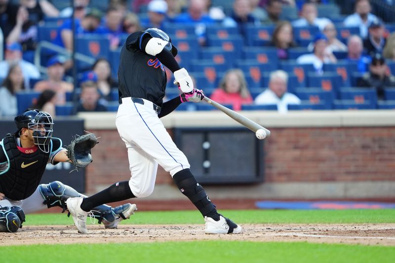 May 31, 2024; New York City, New York, USA; New York Mets left fielder Brandon Nimmo (9) hits a double against the Arizona Diamondbacks during the first inning at Citi Field. Mandatory Credit: Gregory Fisher-USA TODAY Sports