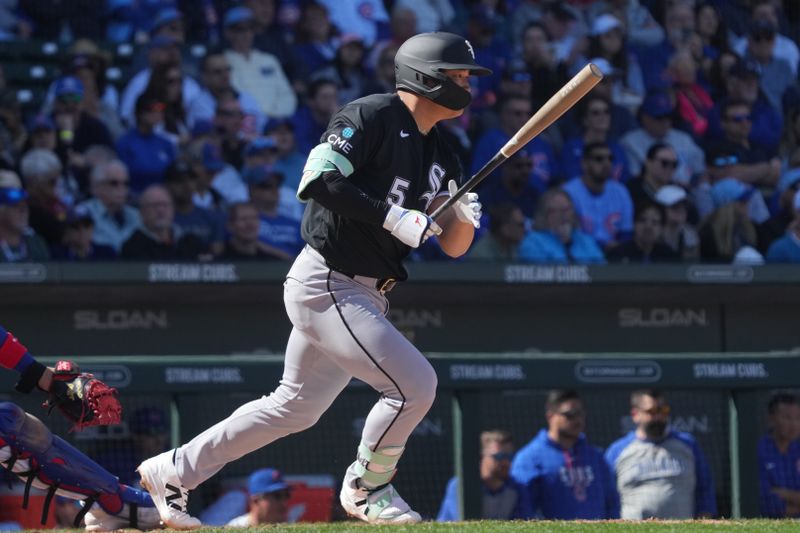 Feb 20, 2026; Mesa, Arizona, USA; Chicago White Sox third baseman Munetaka Murakami (5) hits a single against the Chicago Cubs in the third inning at Sloan Park. Mandatory Credit: Rick Scuteri-Imagn Images