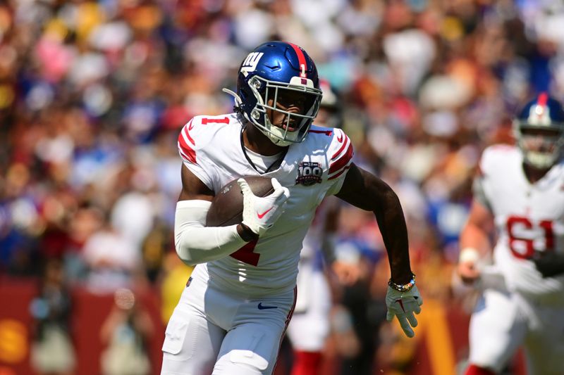 New York Giants wide receiver Malik Nabers (1) runs after a catch against the Washington Commanders during the first half of an NFL football game in Landover, Md., Sunday, Sept. 15, 2024. (AP Photo/Steve Ruark)