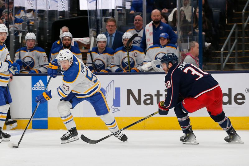 Feb 23, 2024; Columbus, Ohio, USA; Buffalo Sabres left wing Jeff Skinner (53) carries the puck around Columbus Blue Jackets center Boone Jenner (38) during the second period at Nationwide Arena. Mandatory Credit: Russell LaBounty-USA TODAY Sports