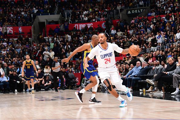 LOS ANGELES, CA - DECEMBER 14: Norman Powell #24 of the LA Clippers dribbles the ball during the game against the Golden State Warriors on December 14, 2023 at Crypto.Com Arena in Los Angeles, California. NOTE TO USER: User expressly acknowledges and agrees that, by downloading and/or using this Photograph, user is consenting to the terms and conditions of the Getty Images License Agreement. Mandatory Copyright Notice: Copyright 2023 NBAE (Photo by Adam Pantozzi/NBAE via Getty Images)