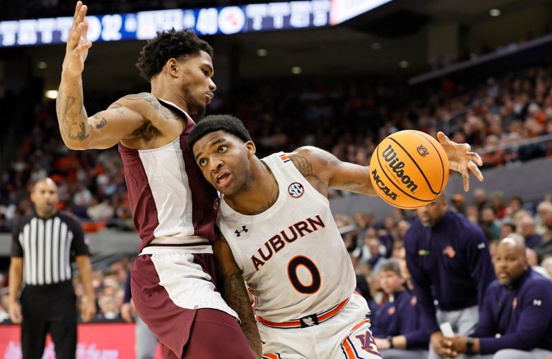 Jan 14, 2023; Auburn, Alabama, USA;  Mississippi State Bulldogs guard Shakeel Moore (3) blocks Auburn Tigers guard Wendell Green Jr. (1) during the second half at Neville Arena. Mandatory Credit: John Reed-USA TODAY Sports