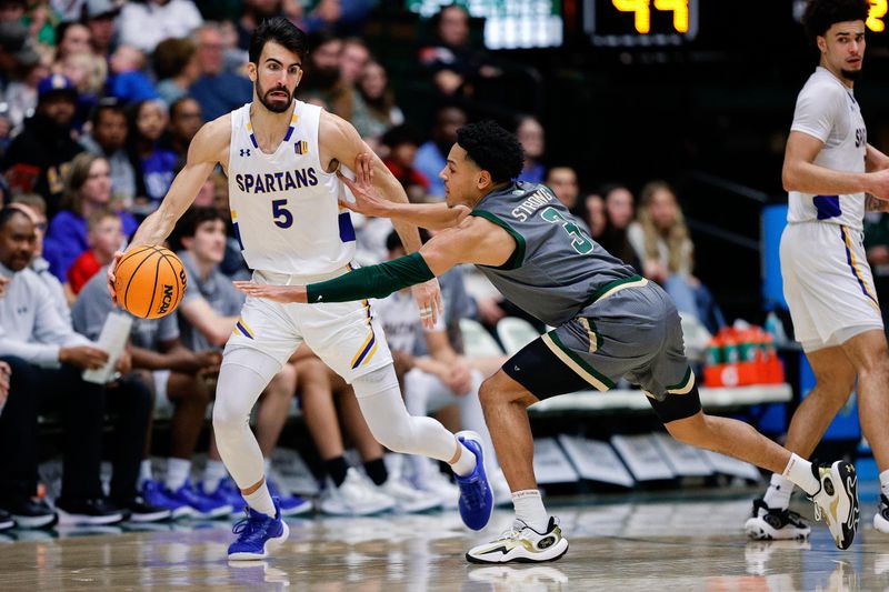 Feb 9, 2024; Fort Collins, Colorado, USA; San Jose State Spartans forward Tibet Gorener (5) controls the ball under pressure from Colorado State Rams guard Josiah Strong (3) in the second half at Moby Arena. Mandatory Credit: Isaiah J. Downing-USA TODAY Sports