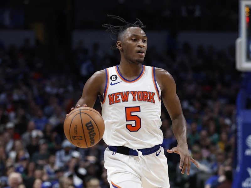 DALLAS, TEXAS - DECEMBER 27:  Immanuel Quickley #5 of the New York Knicks dribbles the ball up court against the Dallas Mavericks in the first half at American Airlines Center on December 27, 2022 in Dallas, Texas. NOTE TO USER: User expressly acknowledges and agrees that, by downloading and or using this photograph, User is consenting to the terms and conditions of the Getty Images License Agreement.  (Photo by Tim Heitman/Getty Images)