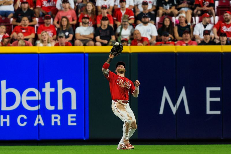 May 25, 2024; Cincinnati, Ohio, USA; Cincinnati Reds outfielder Jake Fraley (27) catches a pop up hit by Los Angeles Dodgers outfielder Chris Taylor (not pictured) in the eighth inning at Great American Ball Park. Mandatory Credit: Katie Stratman-USA TODAY Sports