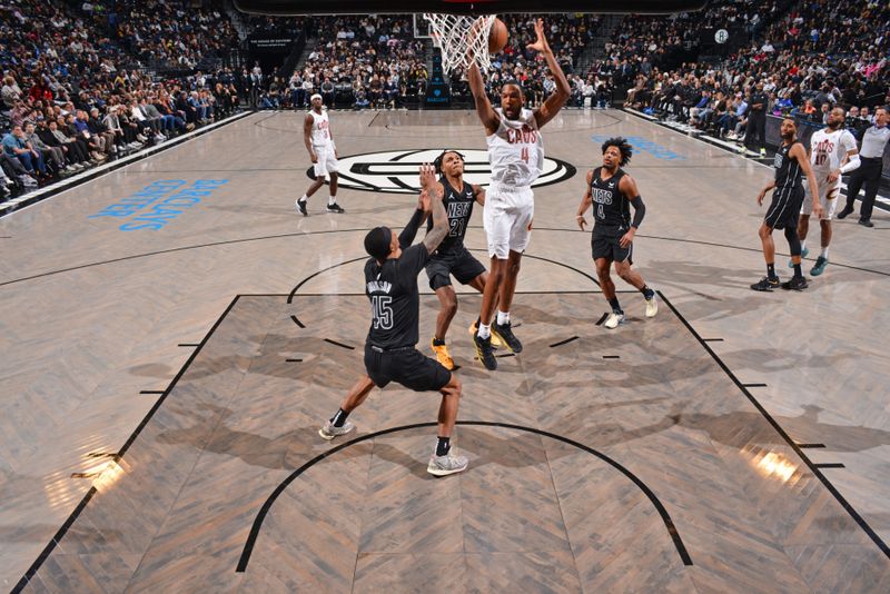 BROOKLYN, NY - FEBRUARY 8: Evan Mobley #4 of the Cleveland Cavaliers rebounds the ball during the game against the Brooklyn Nets on February 8, 2024 at Barclays Center in Brooklyn, New York. NOTE TO USER: User expressly acknowledges and agrees that, by downloading and or using this Photograph, user is consenting to the terms and conditions of the Getty Images License Agreement. Mandatory Copyright Notice: Copyright 2024 NBAE (Photo by Jesse D. Garrabrant/NBAE via Getty Images)