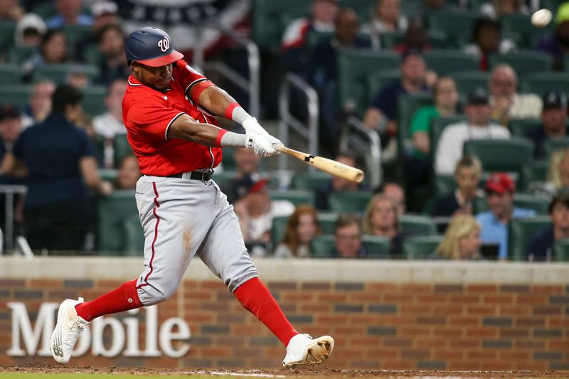 Apr 11, 2022; Atlanta, Georgia, USA; Washington Nationals third baseman Maikel Franco (7) hits a two-run home run against the Atlanta Braves in the third inning at Truist Park. Mandatory Credit: Brett Davis-USA TODAY Sports