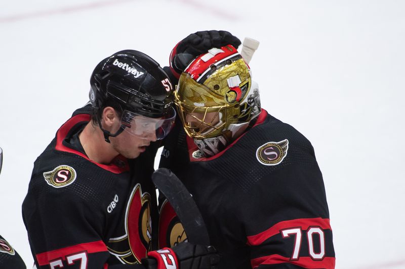 Feb 10, 2024; Ottawa, Ontario, CAN; Ottawa Senators center Shane Pinto (57) celebrates with goalie Joonas Korpisalo (70) their win against the Toronto Maple Leafs at the Canadian Tire Centre. Mandatory Credit: Marc DesRosiers-USA TODAY Sports