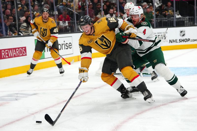 Apr 12, 2024; Las Vegas, Nevada, USA; Minnesota Wild defenseman Jon Merrill (4) checks Vegas Golden Knights left wing Pavel Dorofeyev (16) during the second period at T-Mobile Arena. Mandatory Credit: Stephen R. Sylvanie-USA TODAY Sports