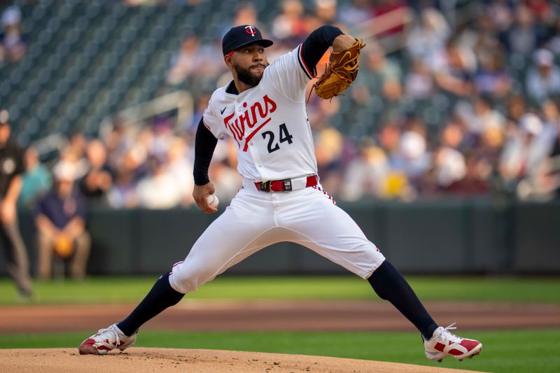 Jun 10, 2025; Minneapolis, Minnesota, USA; Minnesota Twins starting pitcher Simeon Woods Richardson (24) delivers a pitch against the Texas Rangers in the first inning at Target Field. Mandatory Credit: Jesse Johnson-Imagn Images