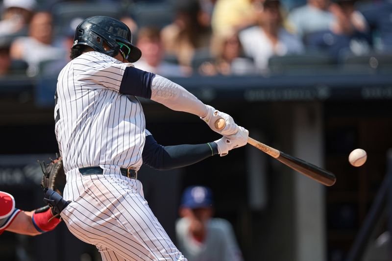 Aug 11, 2024; Bronx, New York, USA; New York Yankees right fielder Juan Soto (22) hits a solo home run during the third inning against the Texas Rangers at Yankee Stadium. Mandatory Credit: Vincent Carchietta-USA TODAY Sports