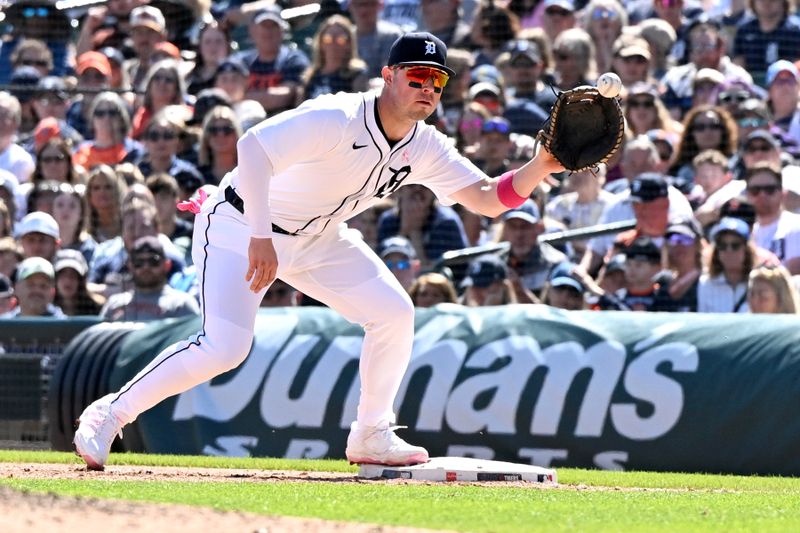 May 11, 2025; Detroit, Michigan, USA; Detroit Tigers first baseman Spencer Torkelson (20) takes a throw from pitcher Brant Hurter (not pictured) to make a put out against the Texas Rangers in the eighth inning at Comerica Park. Mandatory Credit: Lon Horwedel-Imagn Images