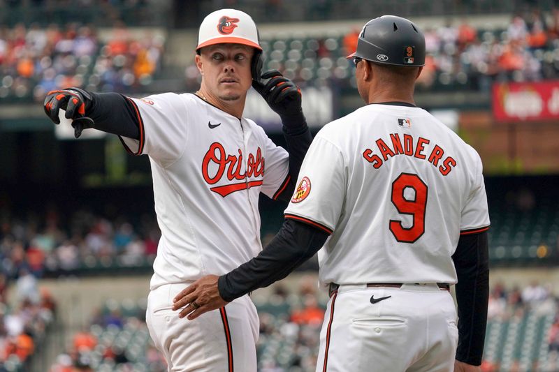 Apr 17, 2024; Baltimore, Maryland, USA; Baltimore Orioles first baseman Ryan Mountcastle (6) gestures towards his teammates following his single in the ninth inning against the Minnesota Twins at Oriole Park at Camden Yards. Mandatory Credit: Mitch Stringer-USA TODAY Sports