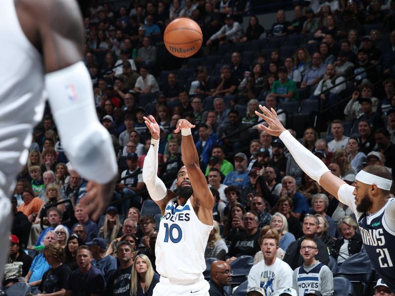 MINNEAPOLIS, MN -  OCTOBER 29: Mike Conley #10 of the Minnesota Timberwolves shoots a three point basket during the game against the Dallas Mavericks on October 29, 2024 at Target Center in Minneapolis, Minnesota. NOTE TO USER: User expressly acknowledges and agrees that, by downloading and or using this Photograph, user is consenting to the terms and conditions of the Getty Images License Agreement. Mandatory Copyright Notice: Copyright 2024 NBAE (Photo by David Sherman/NBAE via Getty Images)