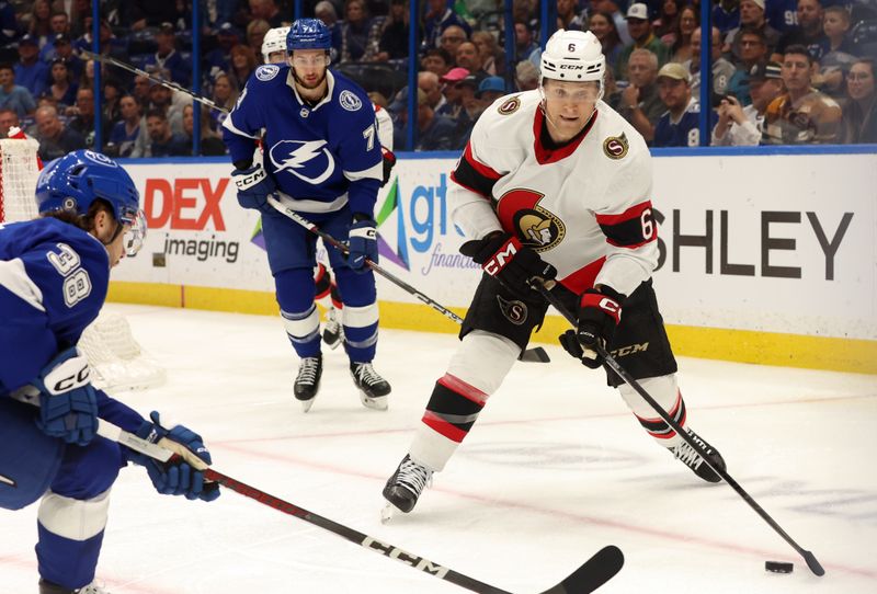 Apr 11, 2024; Tampa, Florida, USA; Ottawa Senators defenseman Jakob Chychrun (6) skates with the puck as Tampa Bay Lightning left wing Brandon Hagel (38) defends during the first period at Amalie Arena. Mandatory Credit: Kim Klement Neitzel-USA TODAY Sports