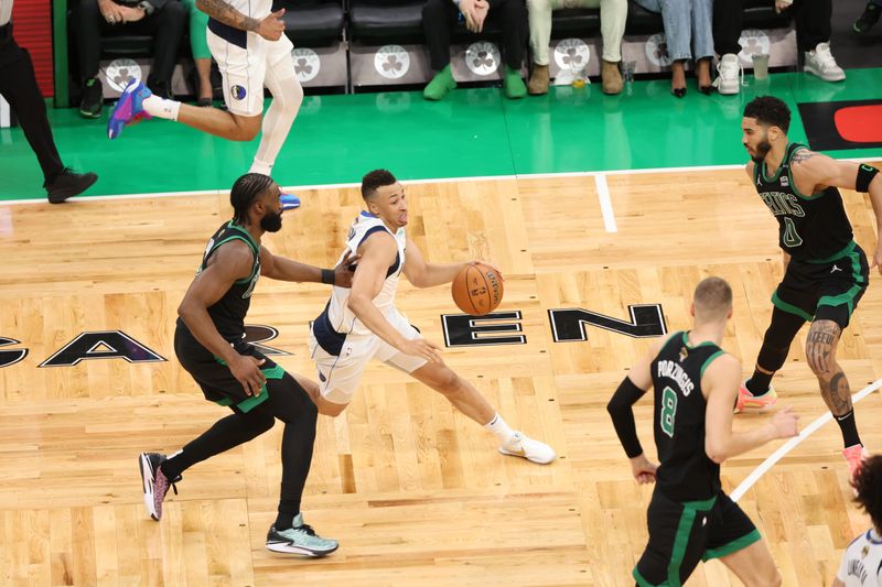 BOSTON, MA - JUNE 9: Dante Exum #0 of the Dallas Mavericks dribbles the ball during the game against the Boston Celtics during Game 2 of the 2024 NBA Finals on June 9, 2024 at the TD Garden in Boston, Massachusetts. NOTE TO USER: User expressly acknowledges and agrees that, by downloading and or using this photograph, User is consenting to the terms and conditions of the Getty Images License Agreement. Mandatory Copyright Notice: Copyright 2024 NBAE  (Photo by Joe Murphy/NBAE via Getty Images)