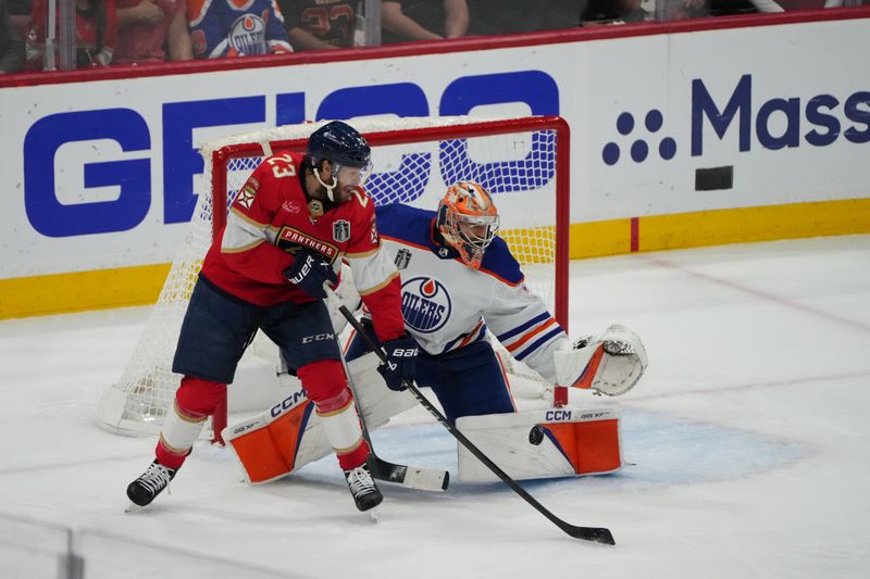 Jun 24, 2024; Sunrise, Florida, USA; Florida Panthers forward Carter Verhaeghe (23) tips in the puck to score against Edmonton Oilers goaltender Skinner Stuart (74) during the first period in game seven of the 2024 Stanley Cup Final at Amerant Bank Arena. Mandatory Credit: Jim Rassol-USA TODAY Sports