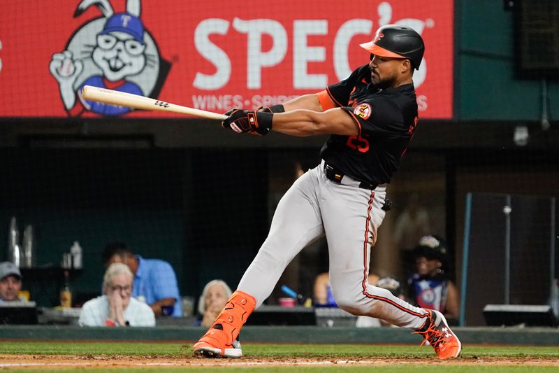 Jul 19, 2024; Arlington, Texas, USA; Baltimore Orioles outfielder Anthony Santander (25) hits a three-run home run during the seventh inning against the Baltimore Orioles at Globe Life Field. Mandatory Credit: Raymond Carlin III-USA TODAY Sports